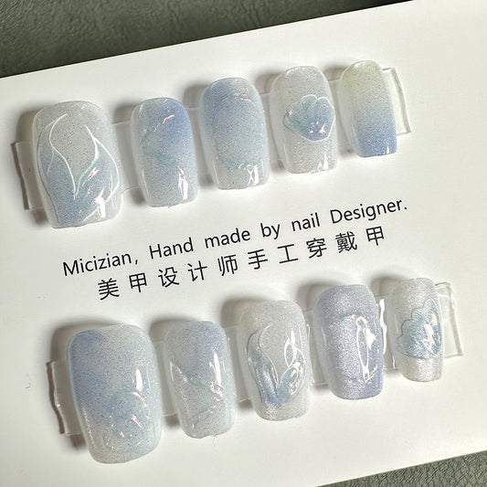 Ocean Mist Elegance : Shimmering White & Blue Cat Eye Nails with Seashell Accents