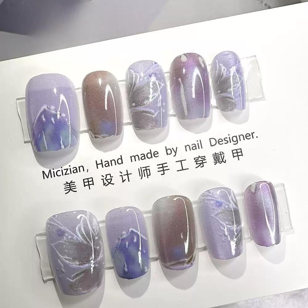 Dreamy Butterfly Whispers : Mystic Purple Cat Eye Marble Nails with Elegant Swirls